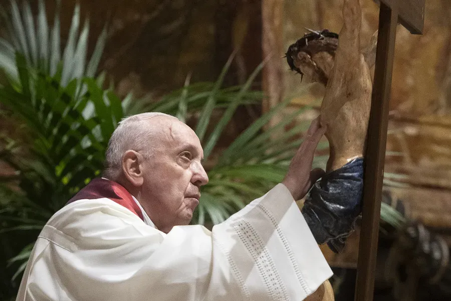 Pope Francis adores the crucifix during the Good Friday liturgy at St. Peter's Basilica April 2, 2021. Credit: Vatican Media